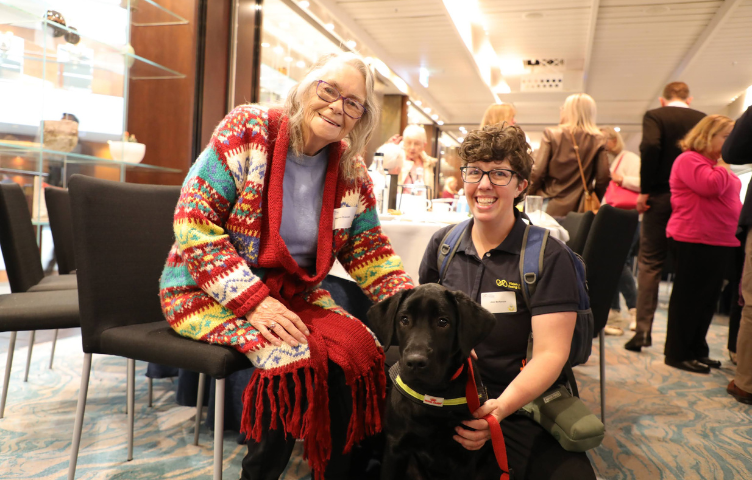 An image of a Iris Circle event participant with a Seeing Eye Dog