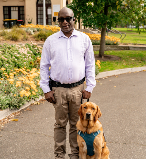 Nemoy and Seeing Eye Dog Benji standing together.