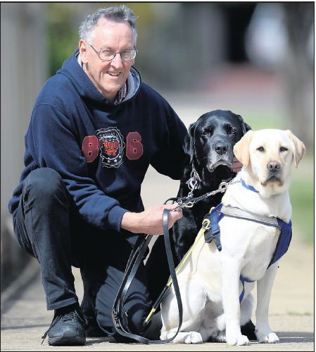 Ron Murley with Seeing Eye Dogs Eden (retired) and Mitchell.