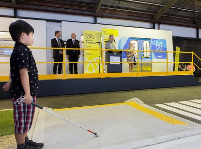 Image shows a young boy with his white cane inside the mobility centre