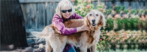Val and her Seeing Eye Dog in the garden