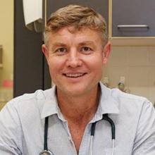Dr Sam Snelling Dr Sam Snelling smiles at camera with stethoscope around neck.